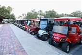 Golf carts parked in a row